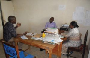 Michael Onguss of FAWE RS in discussions at a meeting with Antoninah, ASRHR teacher at Muslim Girls High School
